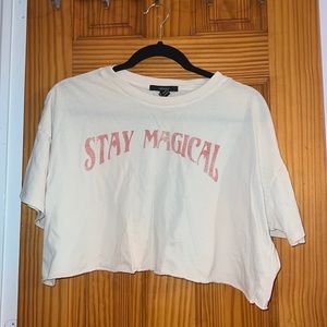 cream/yellow/tan color “stay magical” cropped tee